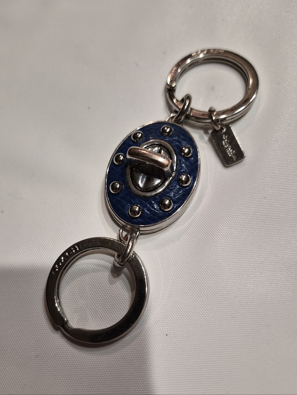 Coach Studded Leather Turnlock Keychain